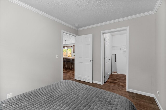 1452 Lower English Creek Rd, Newport, TN 37821 - bedroom featuring wood finished floors, crown molding, baseboards, and a textured ceiling