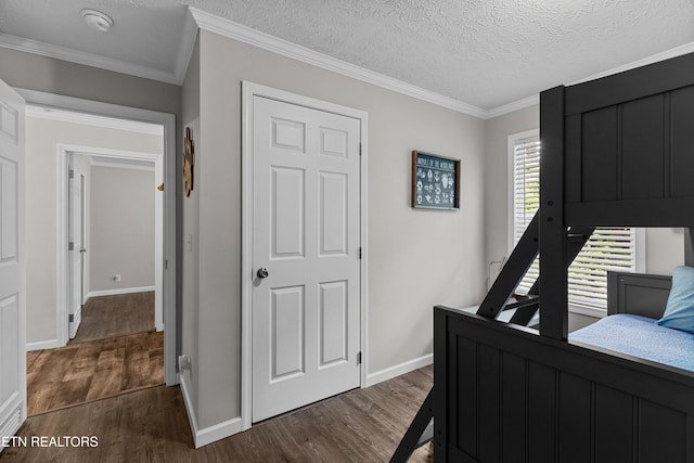 1452 Lower English Creek Rd, Newport, TN 37821 - bedroom with dark wood-type flooring, baseboards, crown molding, and a textured ceiling