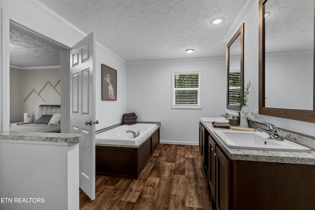 1452 Lower English Creek Rd, Newport, TN 37821 - full bath with a textured ceiling, wood finished floors, a garden tub, crown molding, and double vanity