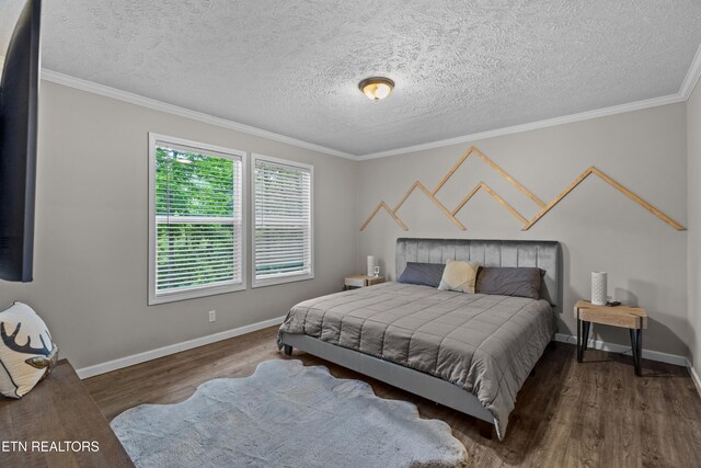 1452 Lower English Creek Rd, Newport, TN 37821 - bedroom with wood finished floors, baseboards, ornamental molding, and a textured ceiling