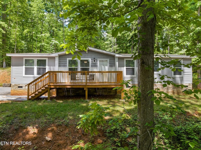 1452 Lower English Creek Rd, Newport, TN 37821 - rear view of house featuring a wooden deck, stairway, and crawl space