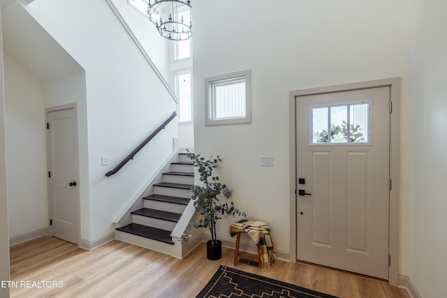 12516 Dalton View Ln, Knoxville, TN 37932 - entryway with wood finished floors, stairway, a high ceiling, and a chandelier