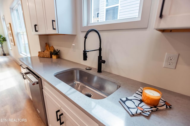 12516 Dalton View Ln, Knoxville, TN 37932 - kitchen featuring stainless steel dishwasher, white cabinets, light stone counters, and light wood finished floors