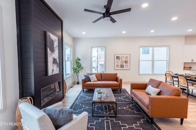 12516 Dalton View Ln, Knoxville, TN 37932 - living area featuring wood finished floors, recessed lighting, a ceiling fan, and a fireplace