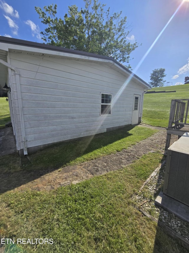 3023 Cave Springs Rd, Tazewell, TN 37879 - view of home's exterior with central AC and a lawn