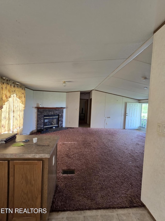 3023 Cave Springs Rd, Tazewell, TN 37879 - unfurnished living room featuring a glass covered fireplace and carpet flooring