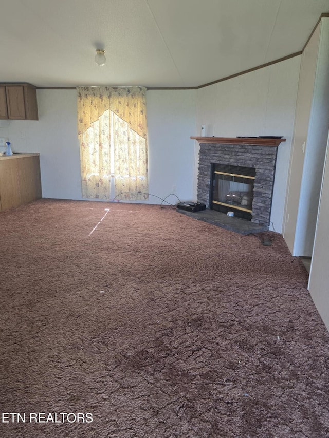 3023 Cave Springs Rd, Tazewell, TN 37879 - unfurnished living room featuring a stone fireplace and carpet flooring
