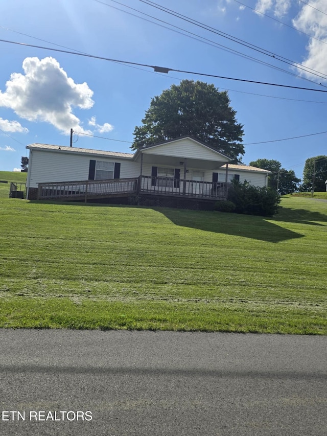 3023 Cave Springs Rd, Tazewell, TN 37879 - view of front of property with a front yard and a wooden deck