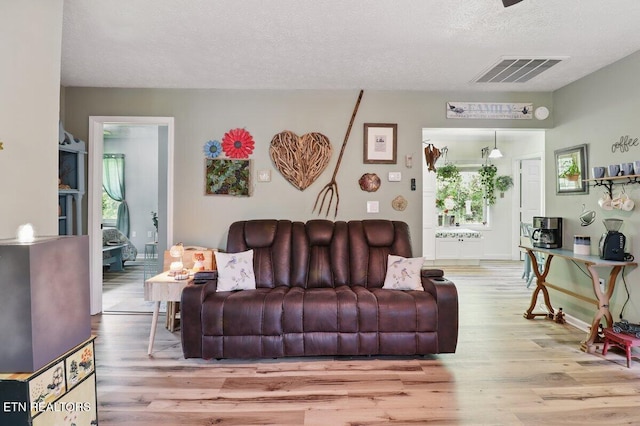 164 Walker Ln, Middlesboro, KY 40965 - living room featuring wood finished floors and a textured ceiling