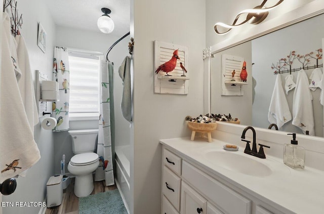 164 Walker Ln, Middlesboro, KY 40965 - full bathroom with wood finished floors, vanity, toilet, and shower / bath combo with shower curtain