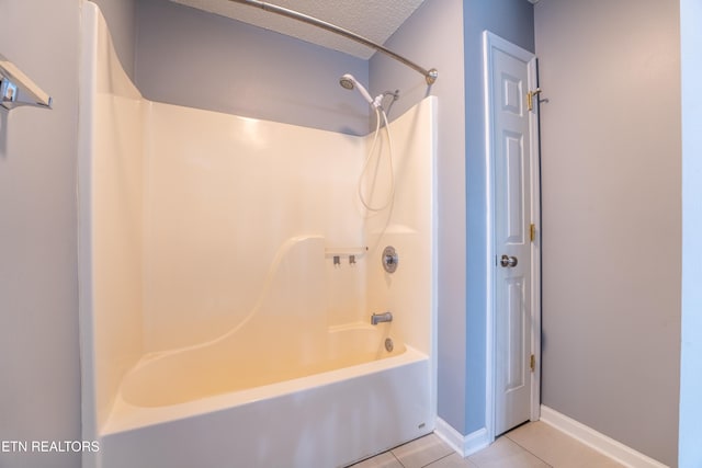 10008 Greylock Way, Knoxville, TN 37931 - full bathroom featuring tile patterned flooring, shower / washtub combination, a textured ceiling, and baseboards