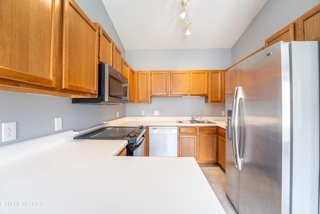 10008 Greylock Way, Knoxville, TN 37931 - kitchen with appliances with stainless steel finishes, a sink, light countertops, track lighting, and a textured ceiling