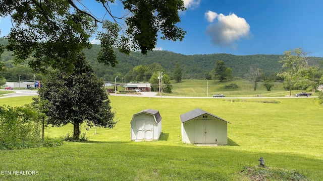 surrounding community featuring a storage unit, an outbuilding, and a yard