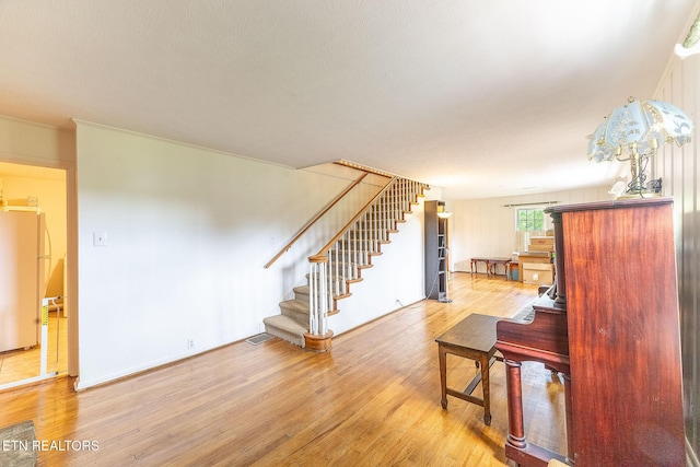 stairway with wood finished floors
