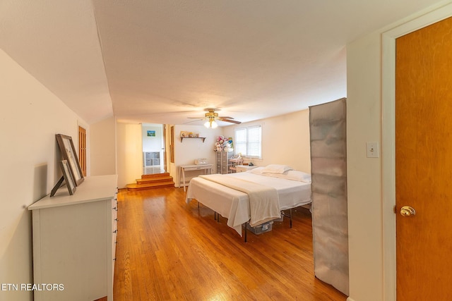 bedroom featuring light wood-style floors and ceiling fan