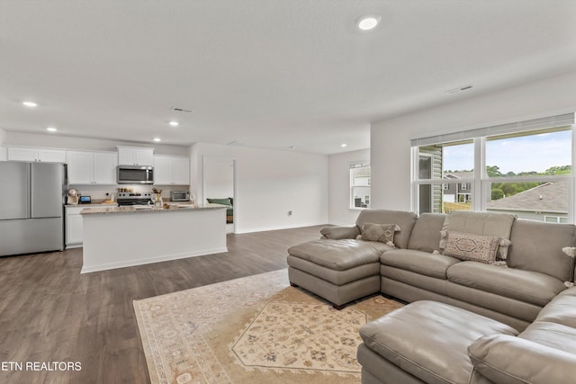 7813 Night Shade Ln, Knoxville, TN 37938 - living area featuring recessed lighting, dark wood finished floors, and baseboards