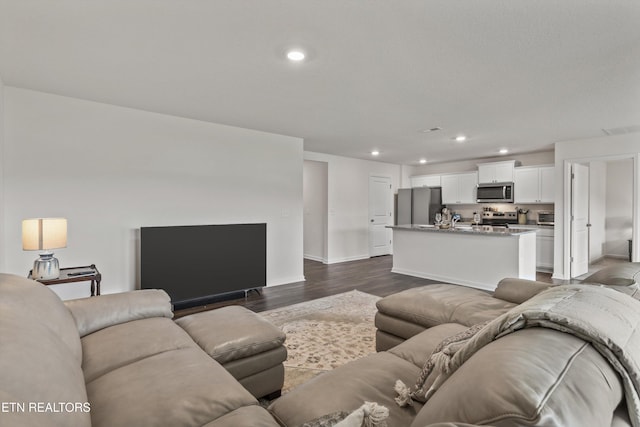 7813 Night Shade Ln, Knoxville, TN 37938 - living area with dark wood-style floors, recessed lighting, and baseboards