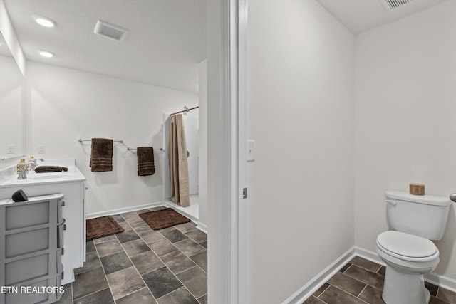 7813 Night Shade Ln, Knoxville, TN 37938 - bathroom with toilet, curtained shower, vanity, recessed lighting, and baseboards