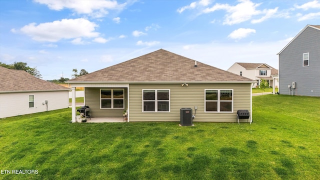 7813 Night Shade Ln, Knoxville, TN 37938 - rear view of property with central AC unit, a yard, a patio, and roof with shingles