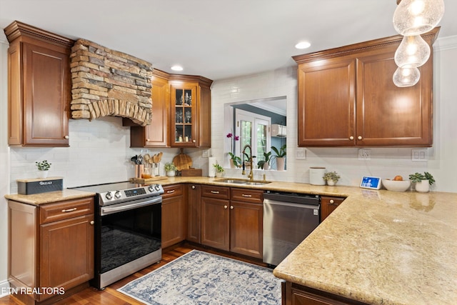 12771 Tanglewood Dr, Knoxville, TN 37922 - kitchen with appliances with stainless steel finishes, a sink, wood finished floors, backsplash, and glass insert cabinets