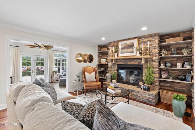 12771 Tanglewood Dr, Knoxville, TN 37922 - living area with ornamental molding, baseboards, ceiling fan, a fireplace, and wood finished floors