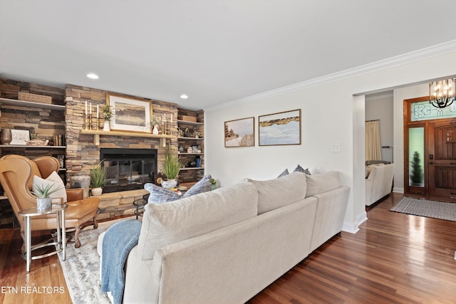 12771 Tanglewood Dr, Knoxville, TN 37922 - living area with ornamental molding, wood finished floors, a stone fireplace, a chandelier, and recessed lighting