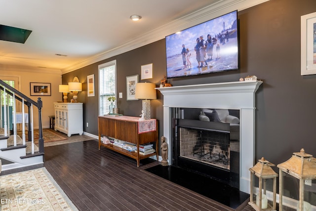 332 Caboose Ln, Maryville, TN 37804 - living room with a fireplace with raised hearth, stairs, wood finished floors, ornamental molding, and baseboards