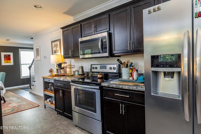 332 Caboose Ln, Maryville, TN 37804 - kitchen featuring appliances with stainless steel finishes, crown molding, light floors, dark countertops, and dark brown cabinets