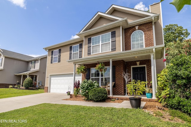 332 Caboose Ln, Maryville, TN 37804 - view of front of property featuring brick siding, driveway, a chimney, and an attached garage