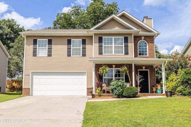332 Caboose Ln, Maryville, TN 37804 - traditional-style home featuring brick siding, concrete driveway, an attached garage, and a chimney