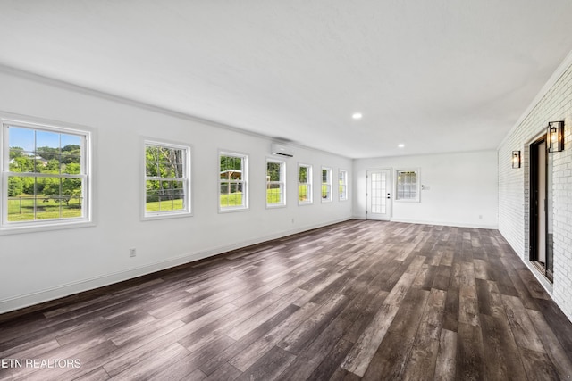 8307 Stoney View Ln, Corryton, TN 37721 - unfurnished living room with dark wood finished floors, a wall mounted air conditioner, baseboards, and recessed lighting