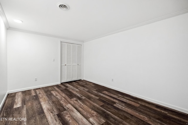 8307 Stoney View Ln, Corryton, TN 37721 - unfurnished bedroom featuring crown molding, dark wood-type flooring, baseboards, and a closet
