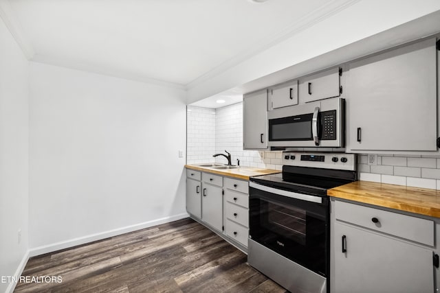 8307 Stoney View Ln, Corryton, TN 37721 - kitchen with stainless steel appliances, wood counters, crown molding, a sink, and tasteful backsplash
