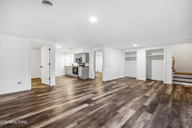 8307 Stoney View Ln, Corryton, TN 37721 - unfurnished living room with dark wood-style flooring, stairway, baseboards, and recessed lighting