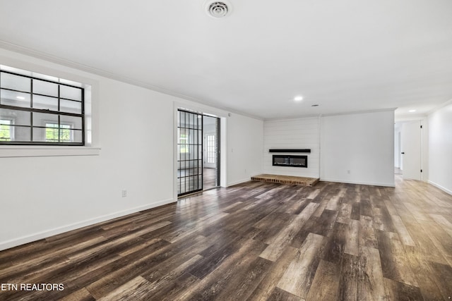 8307 Stoney View Ln, Corryton, TN 37721 - unfurnished living room with plenty of natural light, dark wood finished floors, crown molding, baseboards, and recessed lighting