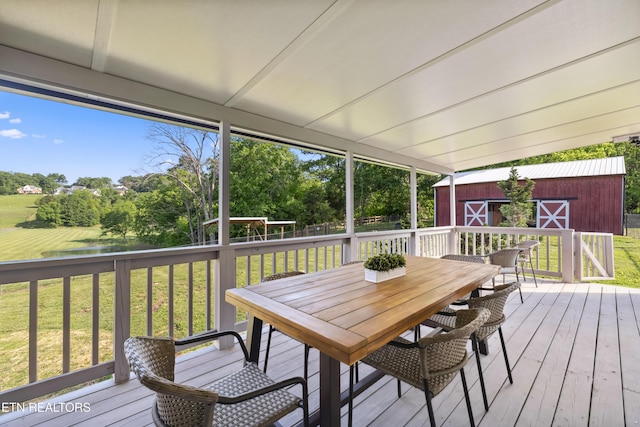 8307 Stoney View Ln, Corryton, TN 37721 - wooden terrace with an outdoor structure, a lawn, view of wooded area, and outdoor dining space