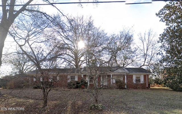 single story home with brick siding