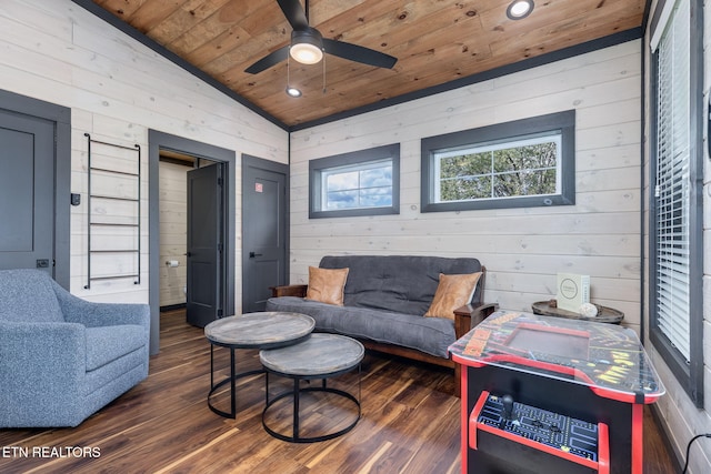 living room featuring wooden ceiling, vaulted ceiling, wood finished floors, wooden walls, and ceiling fan