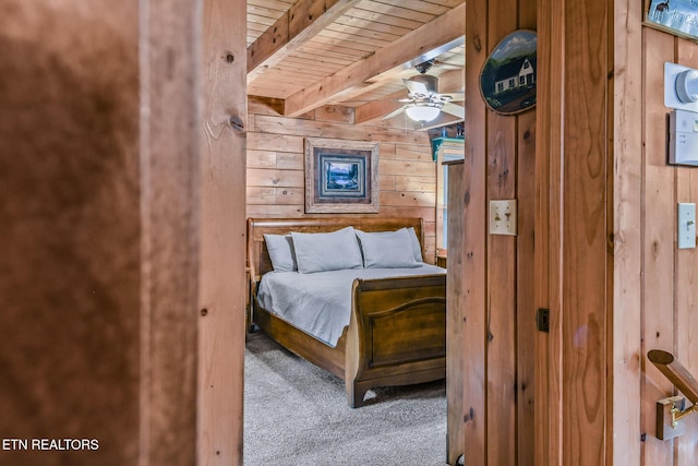 813 Pine Top Ln, Gatlinburg, TN 37738 - bedroom with wood walls, carpet flooring, and wood ceiling with exposed beams