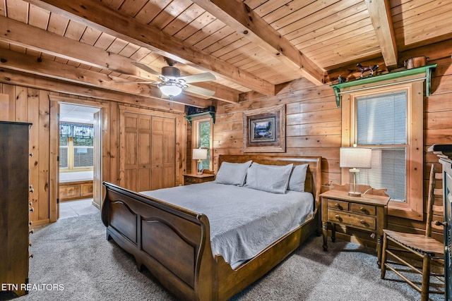 813 Pine Top Ln, Gatlinburg, TN 37738 - bedroom with wooden ceiling with exposed beams, wood walls, and carpet