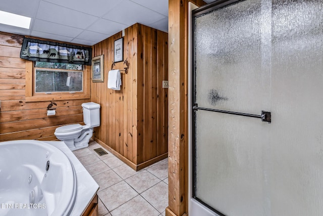 813 Pine Top Ln, Gatlinburg, TN 37738 - bathroom with toilet, wood walls, a jetted tub, tile patterned floors, and a stall shower