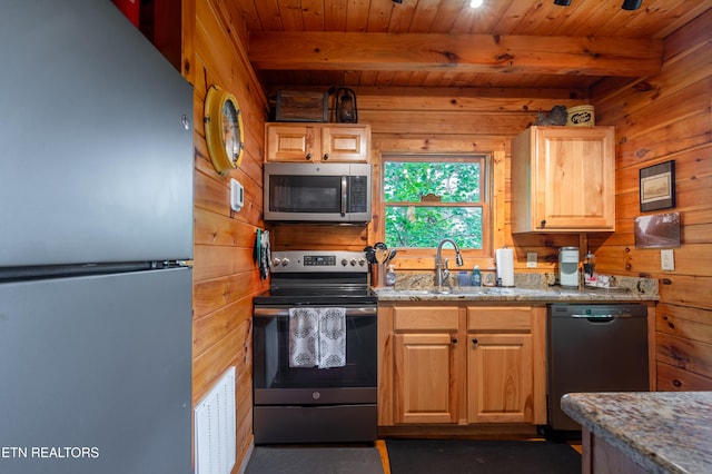 4186 Evans Chapel Rd, Sevierville, TN 37876 - kitchen with appliances with stainless steel finishes, wooden walls, beam ceiling, wooden ceiling, and light stone counters