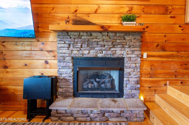 4186 Evans Chapel Rd, Sevierville, TN 37876 - detailed view of a fireplace, wood finished floors, and wooden walls