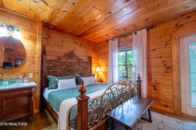 4186 Evans Chapel Rd, Sevierville, TN 37876 - bedroom featuring wood walls, wood ceiling, wood finished floors, and a sink