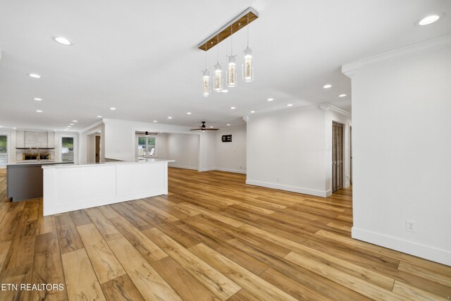520 S David Ln, Knoxville, TN 37922 - unfurnished living room featuring crown molding, recessed lighting, baseboards, light wood-style flooring, and a ceiling fan