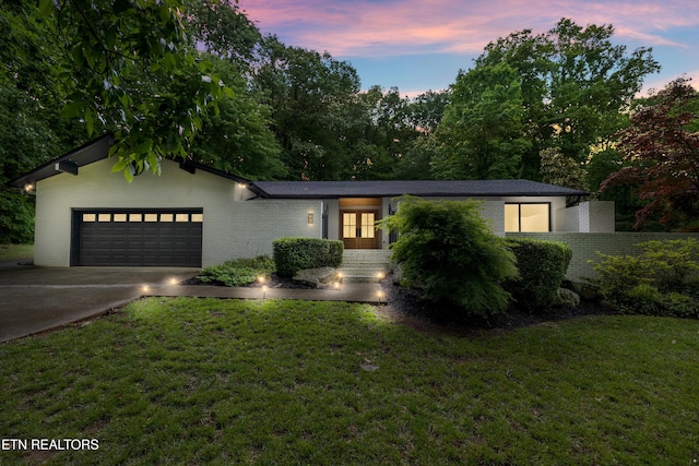 520 S David Ln, Knoxville, TN 37922 - single story home featuring french doors, brick siding, driveway, a yard, and a garage