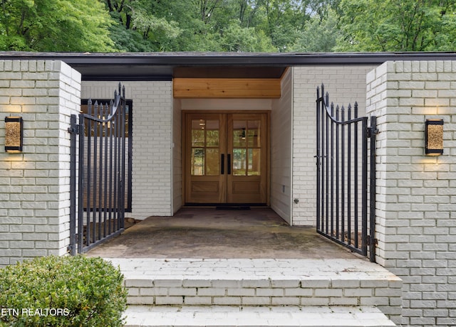 520 S David Ln, Knoxville, TN 37922 - view of exterior entry featuring french doors, brick siding, and a gate