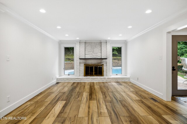 520 S David Ln, Knoxville, TN 37922 - unfurnished living room with crown molding, a fireplace, wood finished floors, baseboards, and healthy amount of natural light