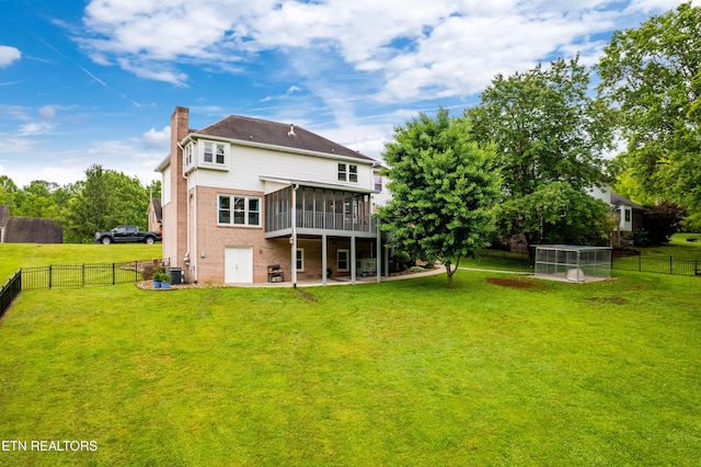 back of property with a sunroom, a chimney, a patio, cooling unit, and brick siding