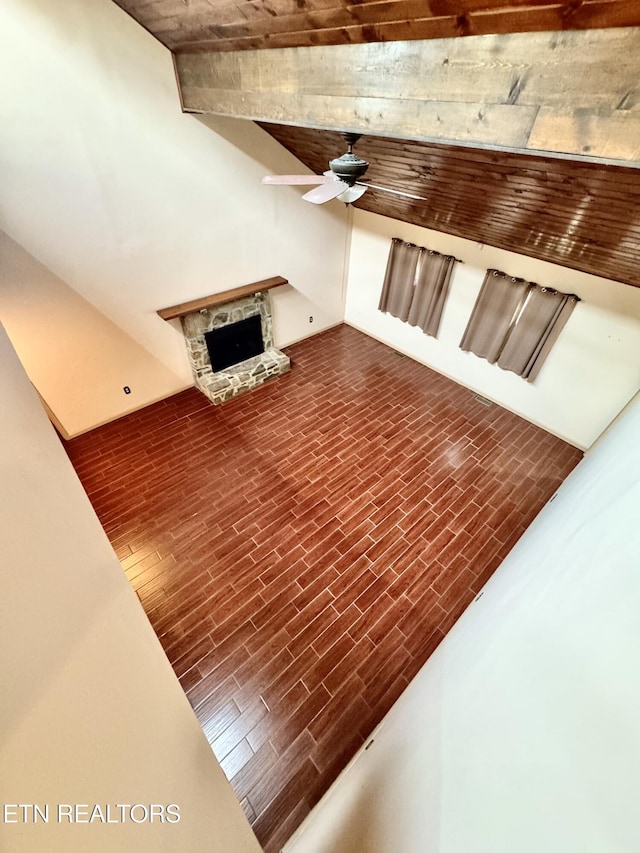 721 Fan St, Tazewell, TN 37879 - unfurnished living room with a ceiling fan, a stone fireplace, and wood ceiling